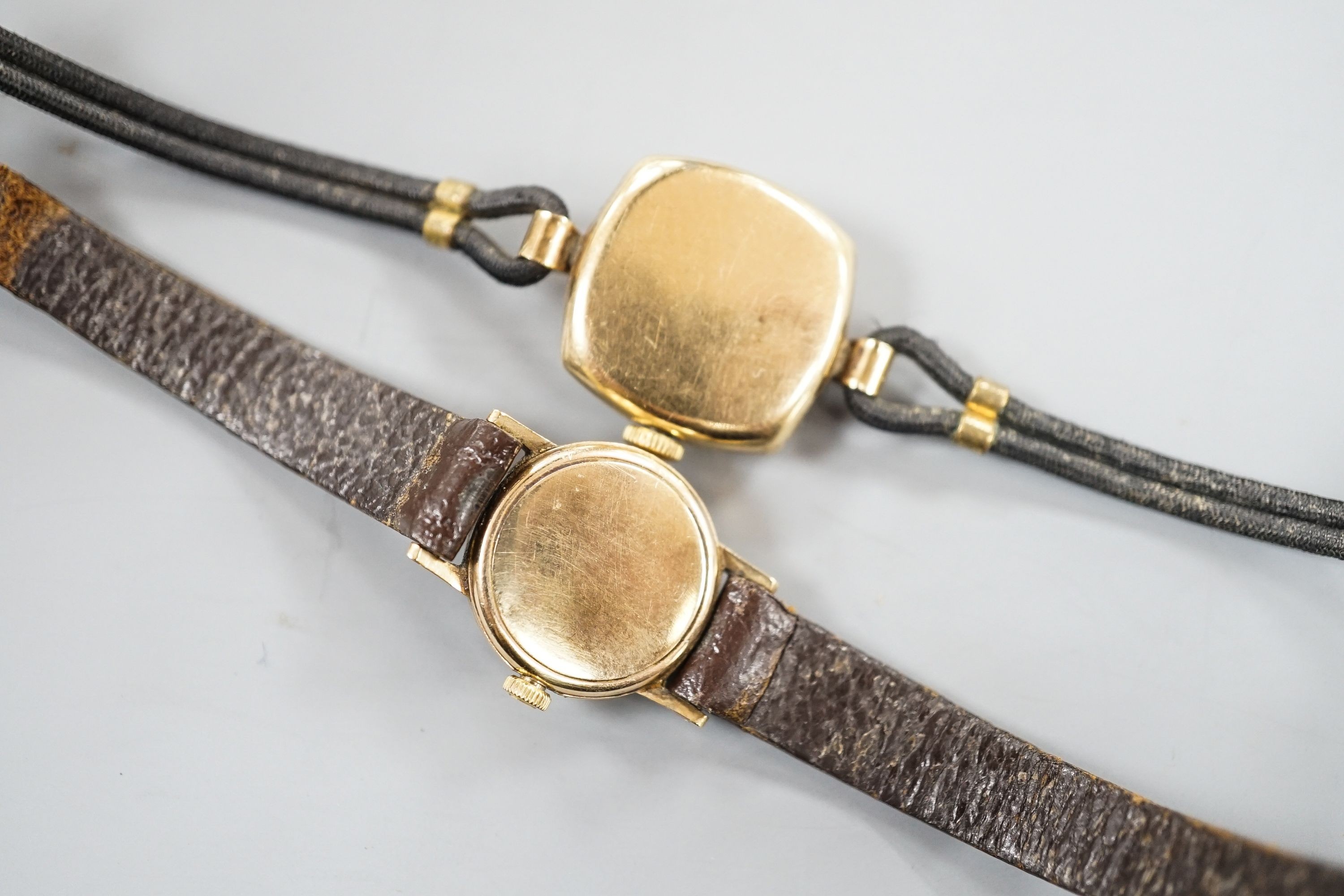 A lady's yellow metal Omega manual wind wrist watch, on leather strap and a similar 9ct Pinnacle watch.